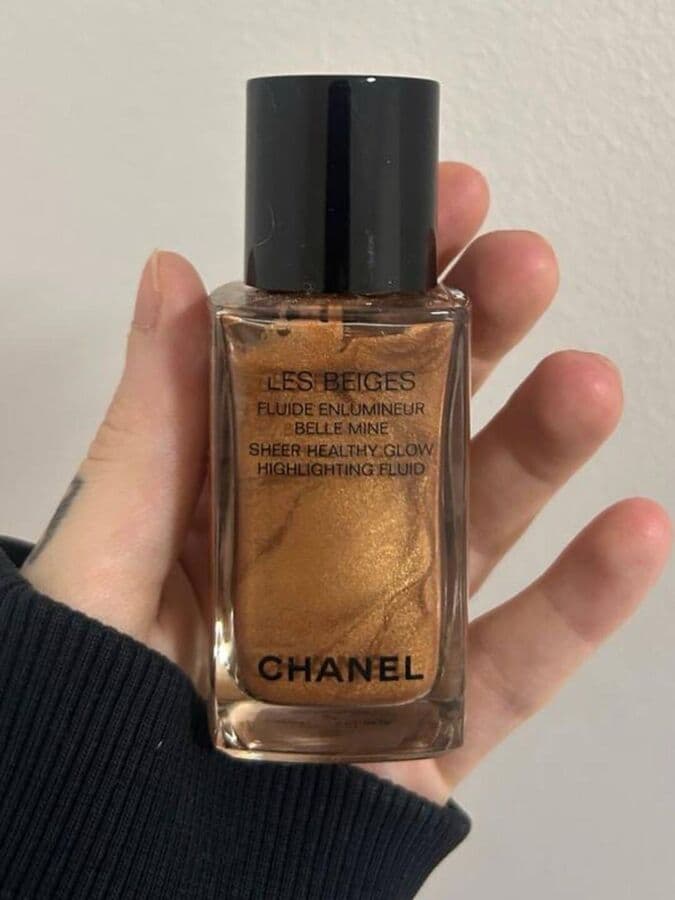 Phone photo of a highlighting fluid bottle held in a hand